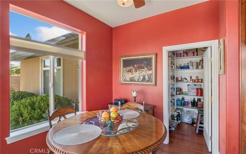 Wlakin pantry next to the breakfast nook