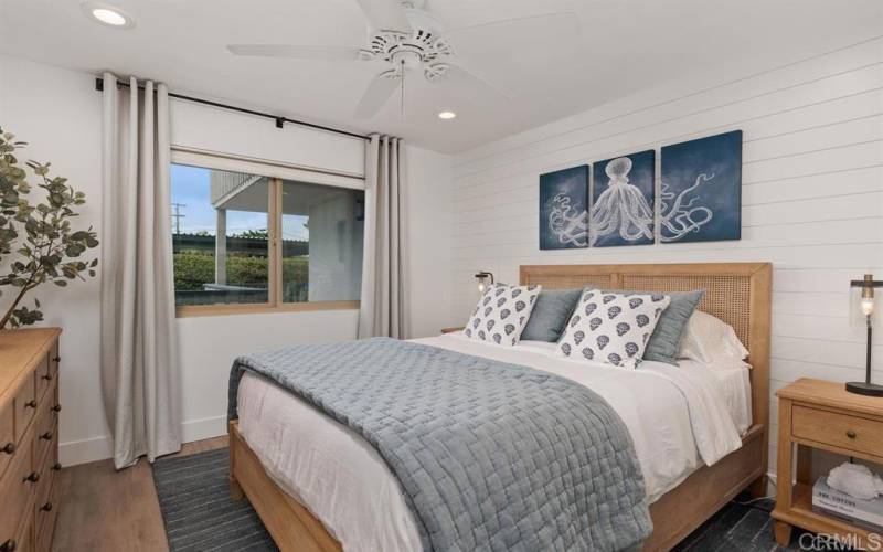 Secondary bedroom has a TV, window to open for those ocean breezes too!