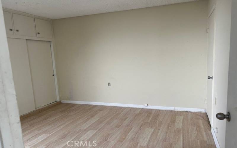 Guest bedroom overlooks the atrium and has lots of closets.