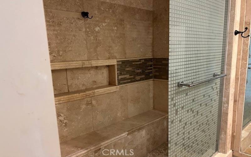 Hall bathroom has a custom walk in shower.