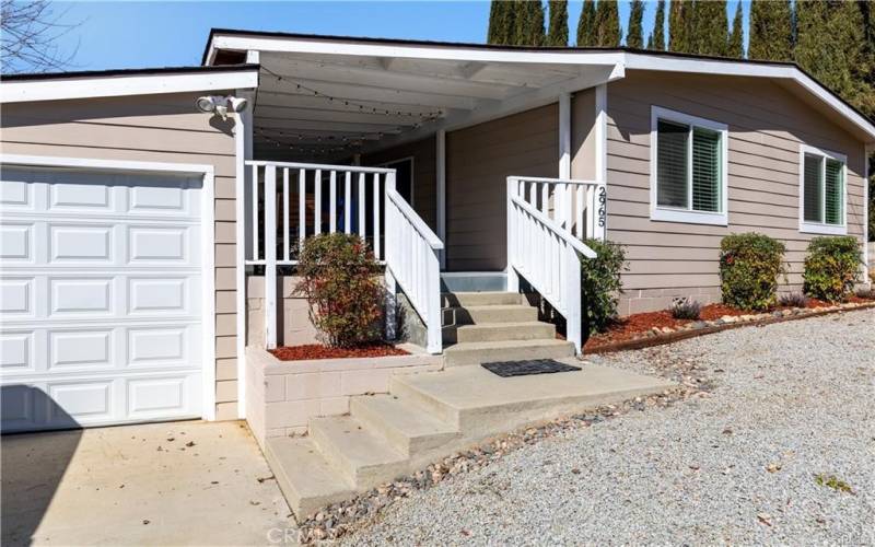 Covered deck entry with attached 1 car garage