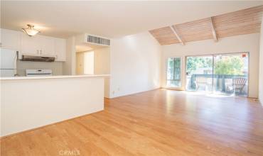 Dining room, living room and kitchen.