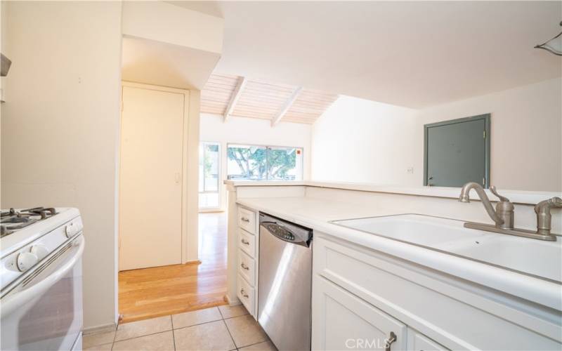 Kitchen with gas range, dishwasher.