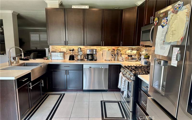 Features : Espresso Shaker Cabinets and New Quartz Countertops