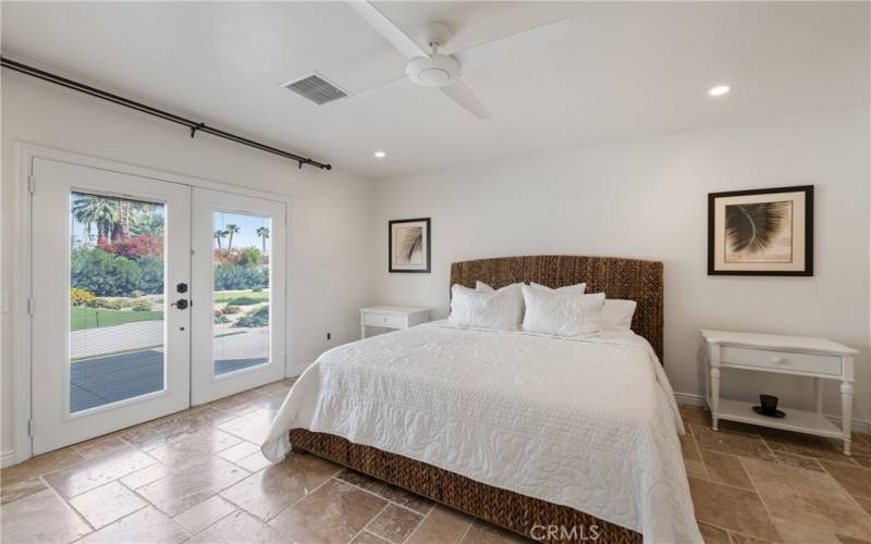 Primary Bedroom with view of the putting green and the pool