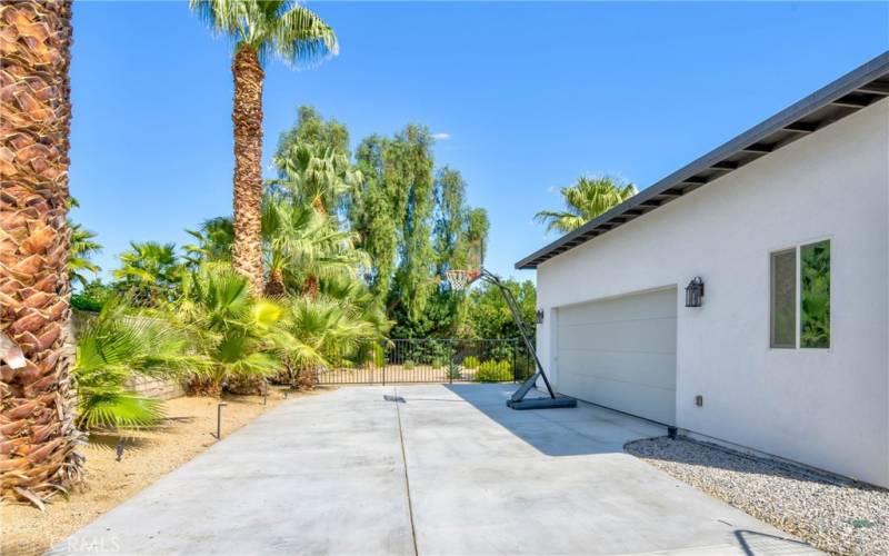 Basketball hoop and driveway to attached garage