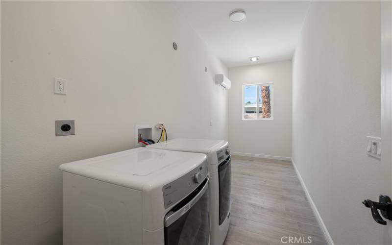 Full laundry room space off of the garage