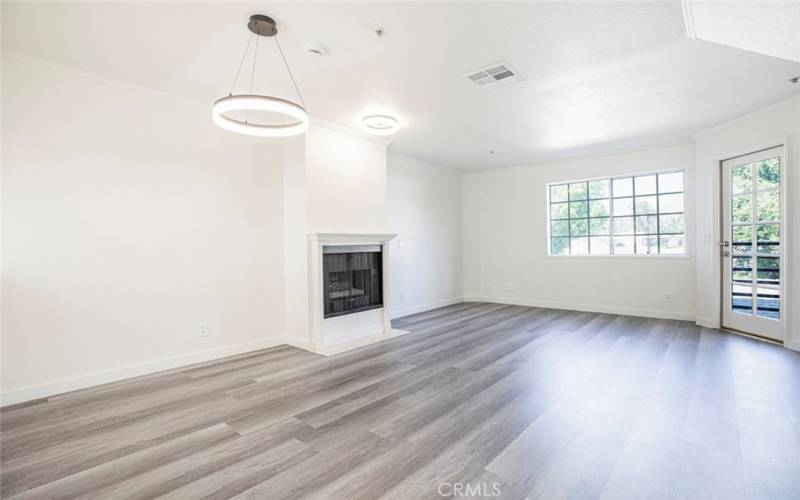 Living room with Fireplace and door to sitting area.