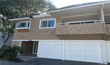 Front of home. 2 car garage w/ single doors