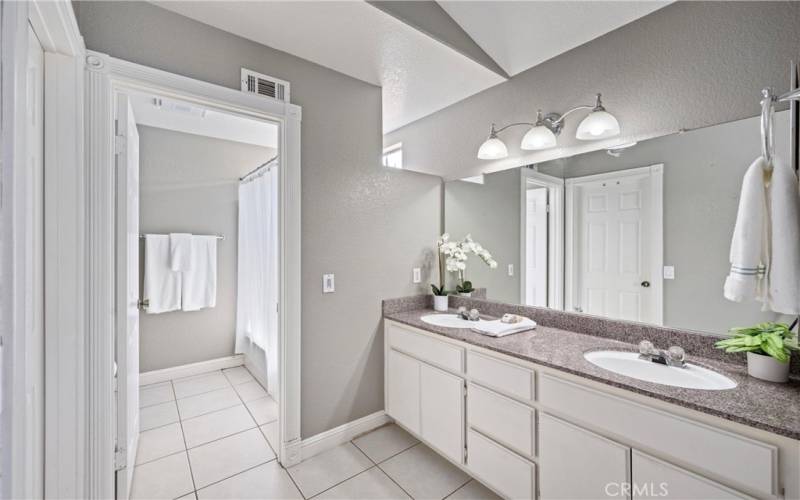 Primary Bathroom: note the tile floor and dual sinks