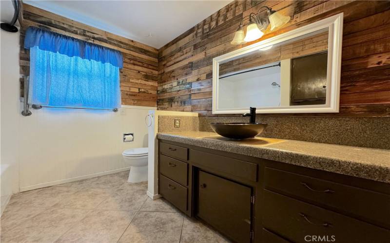 Guest Bathroom With Unique Wood Backsplash