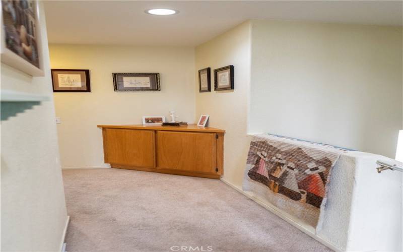 hallway upstairs that leads to more bedrooms