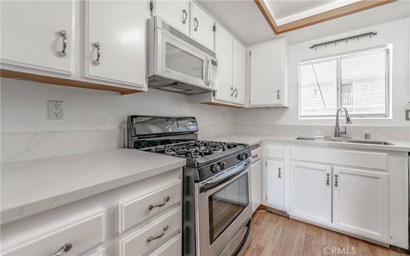 Stainless Steel Appliances with White Cabinets