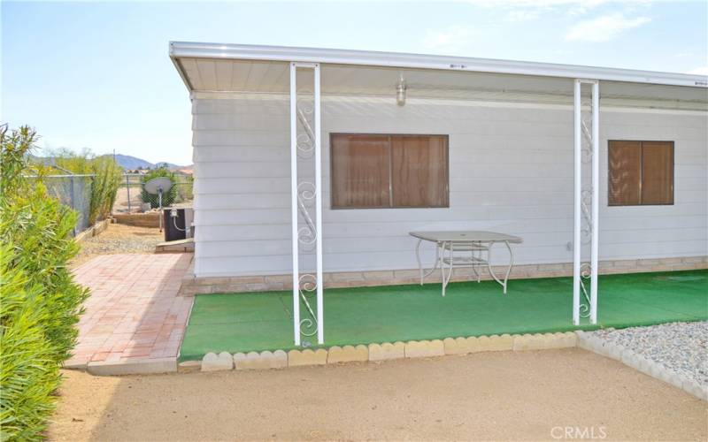 This particular space offers a good-sized yard which is fully fenced for your fur babies, a large covered patio, easy-care desert landscaping, and no neighbors right behind for unobstructed sunrise views.