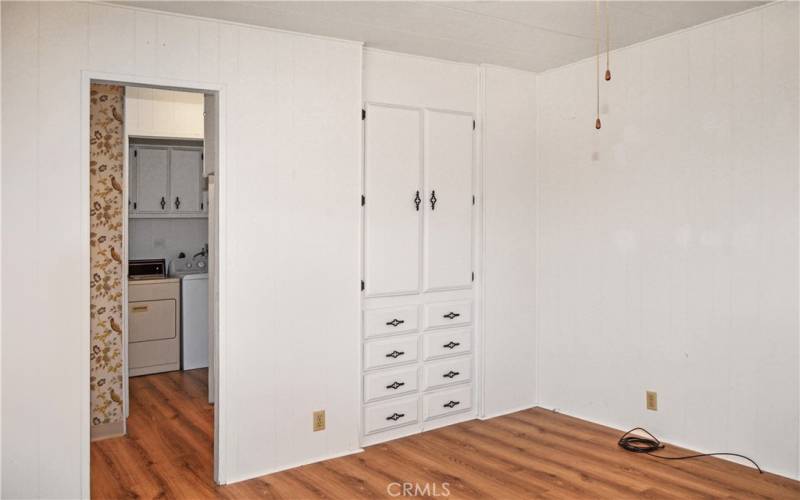 The 2nd bedroom has direct access to the 2nd bath, built-in cabinetry, a walk-in closet, and a ceiling fan which make it feel like another primary suite.