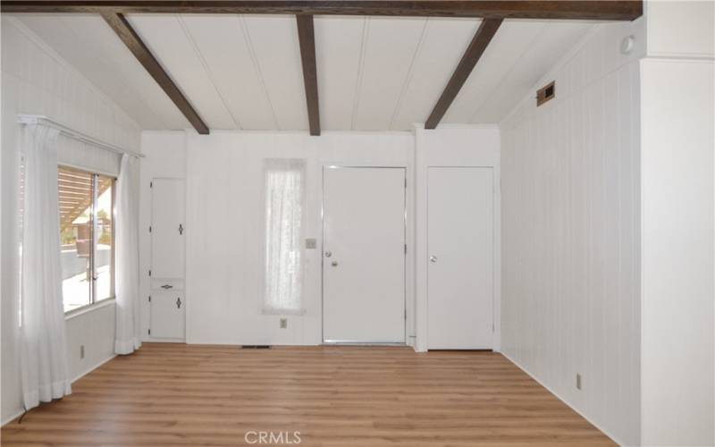 A coat closet and a handy built-in cabinet near the entry are so convenient.