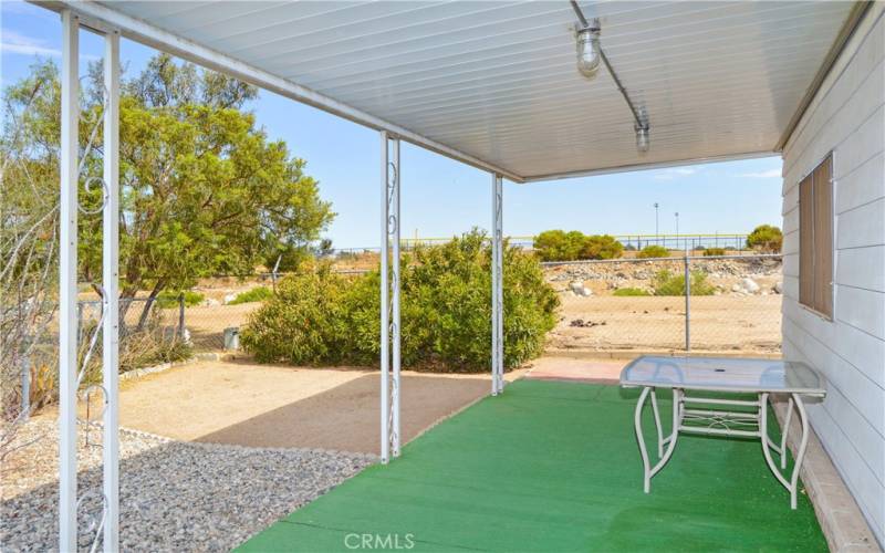 This particular space offers a good-sized yard which is fully fenced for your fur babies, a large covered patio, easy-care desert landscaping, and no neighbors right behind for unobstructed sunrise views.