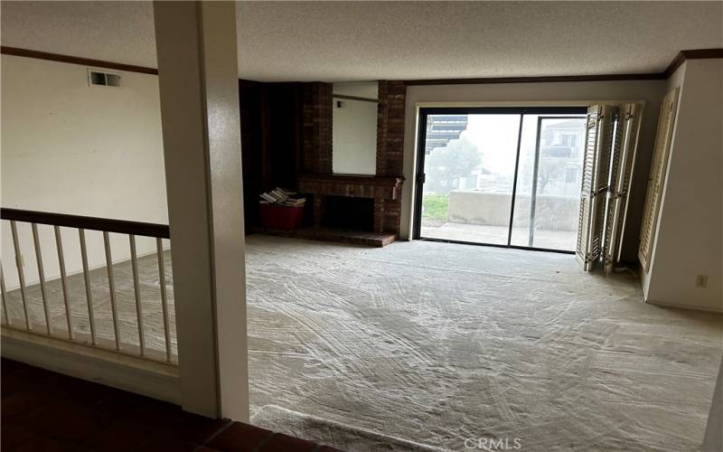 Sunken living room. Step down from tile entry.