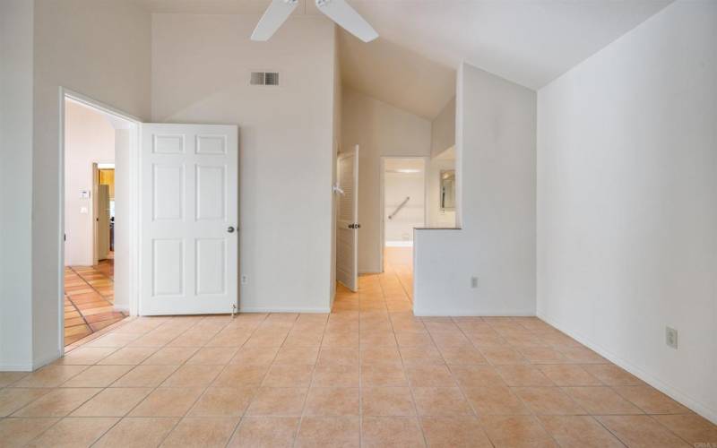 Walls painted neutral color and light beige tile flooring.