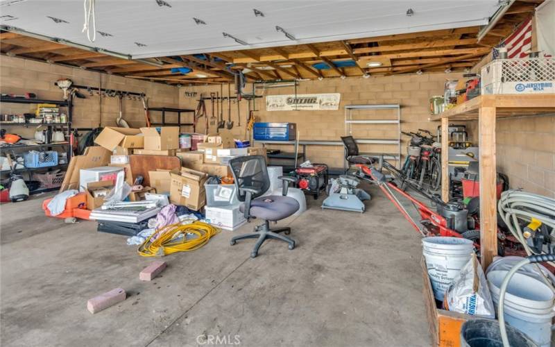 Detached garage with a man door and a roll up door