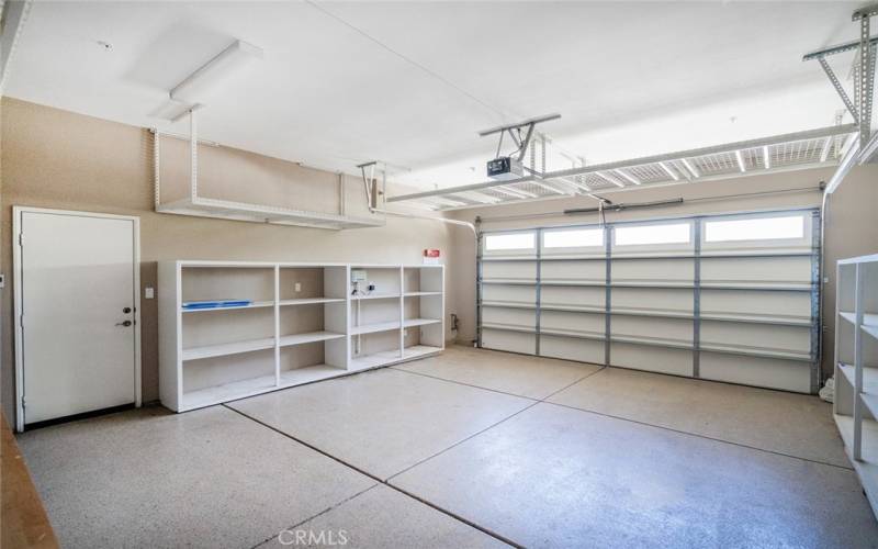 large garage with abundance of shelving