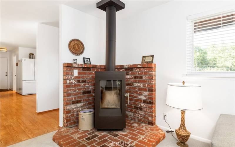 Cozy up with a blanket and a book and enjoy the warmth of the wood burning stove.