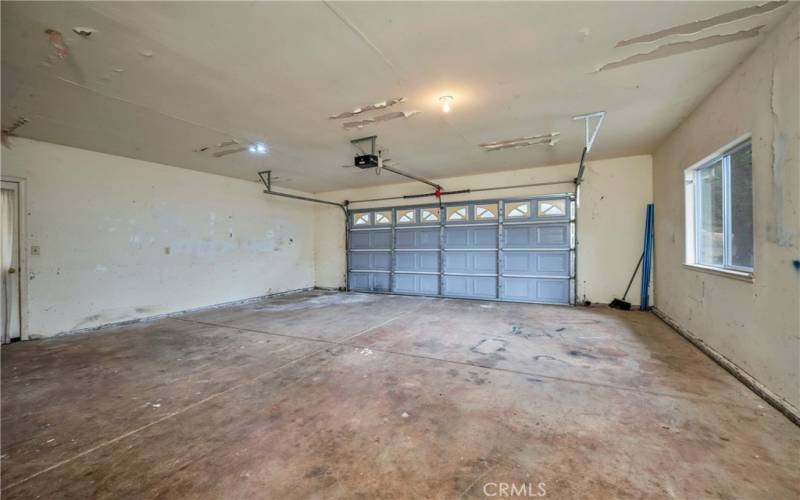 Large garage with opener.