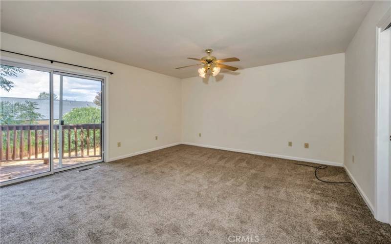 Primary bedroom opens to rear deck.