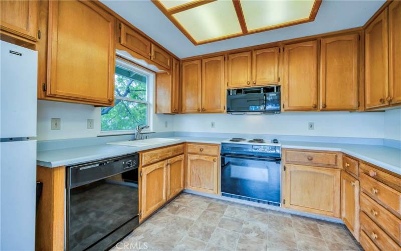 Kitchen overlooks back deck.