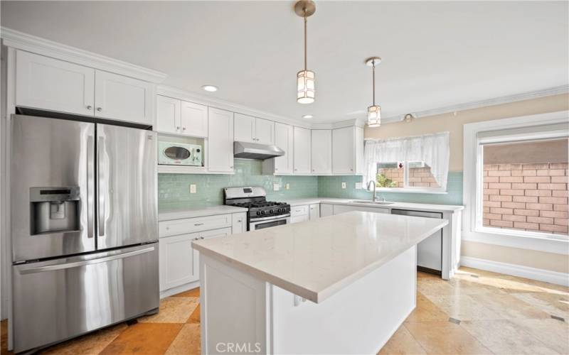 Kitchen Island and stainless steel appliances.