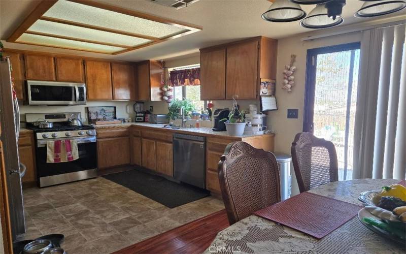 Kitchen with sliding glass door to back yard.