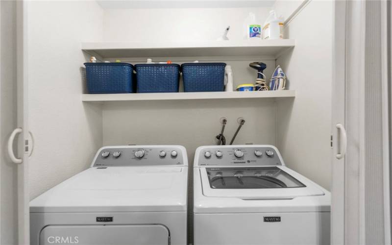 Laundry closet located in bathroom