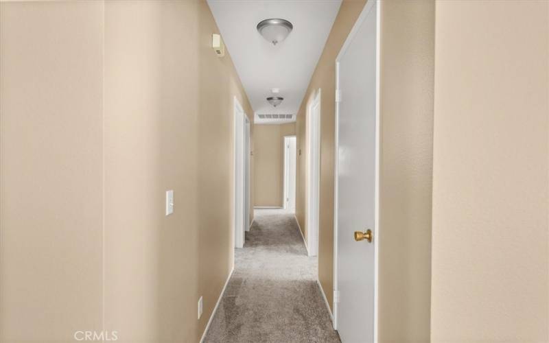 Hallway with Full Bathroom, Coat Closet, Bedrooms, Linen Closet & Laundry Rm