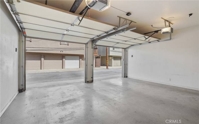 Plenty of space in garage with cabinets for extra storage