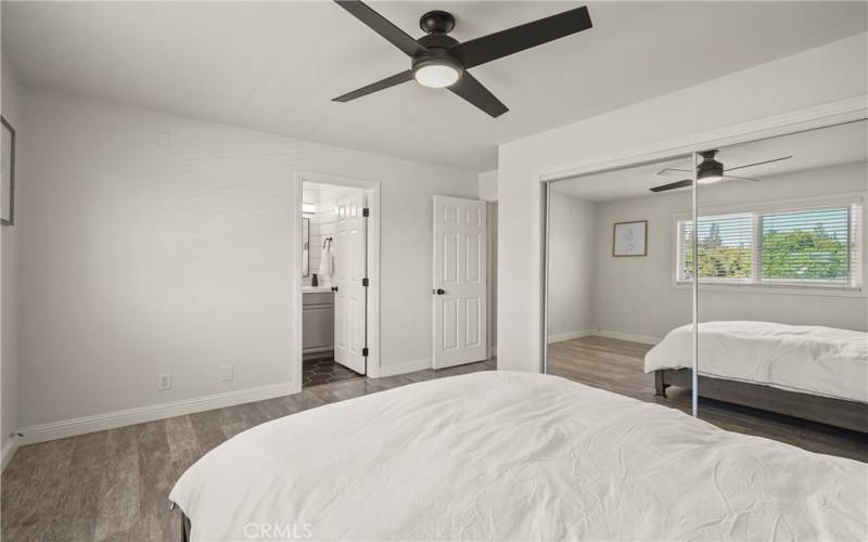 Primary Bedroom: Wall-to-wall mirrored closet