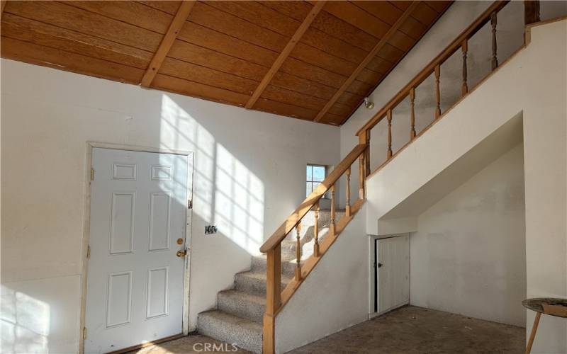 Front entrance into living room,stairway to second floor.