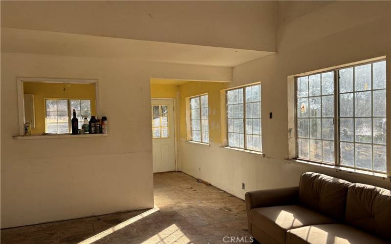 Living room, looking from front door toward kitchen.