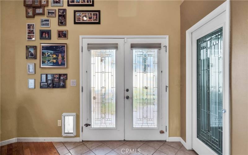 * Double Doors Leading To Back Yard Patio From Family Room *