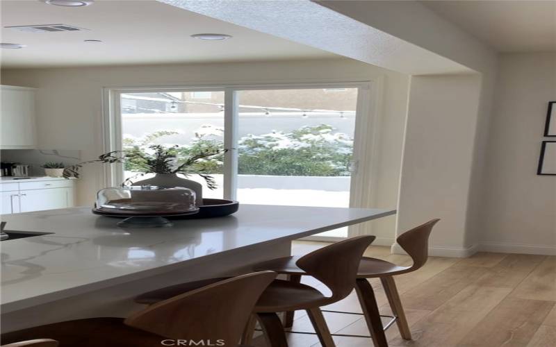 Glimpse of kitchen to backyard