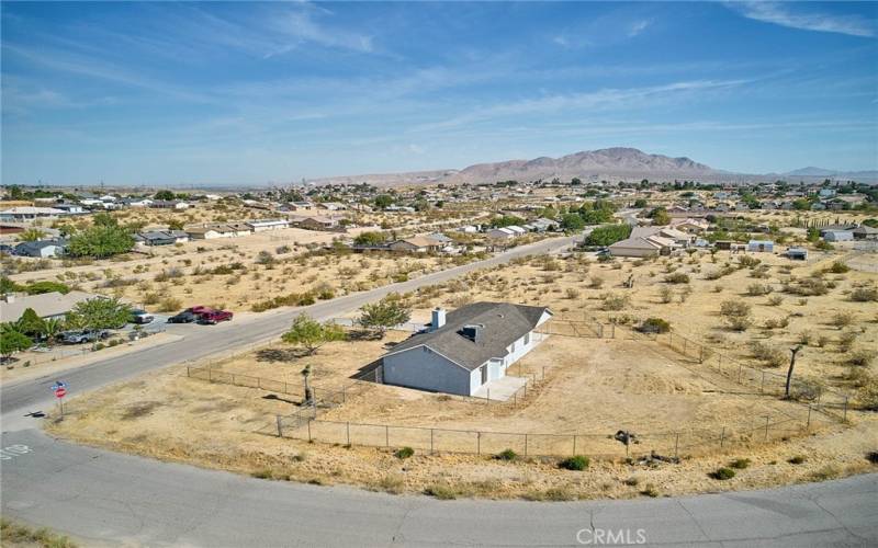 Lateral aerial view of corner lot.