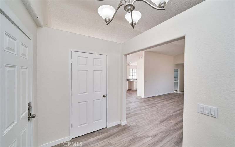 Main entrance door with access to garage door and front closet.