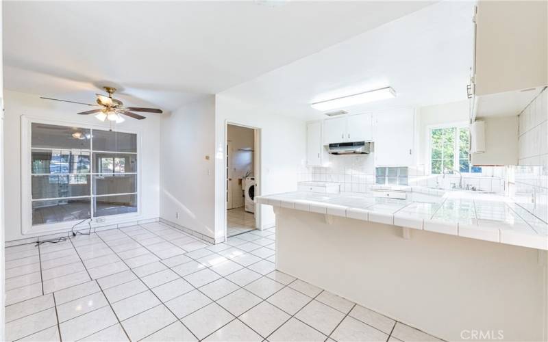 Bright Kitchen with White Tile Counter Tops