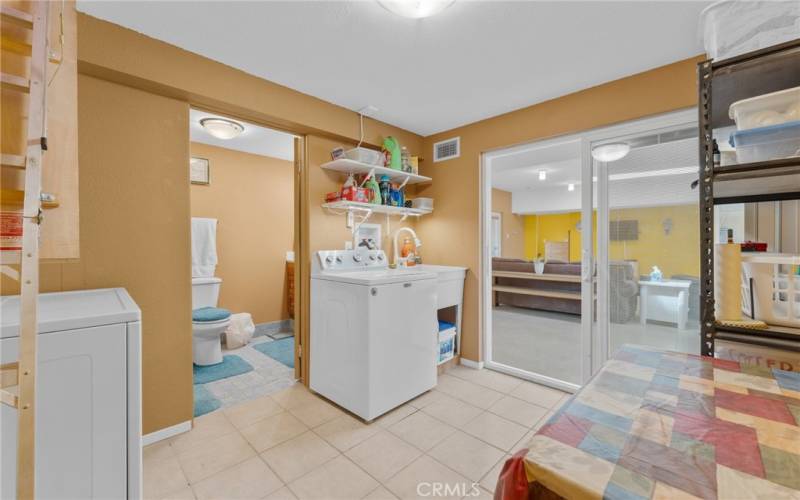 a large laundry room, featuring space for storage