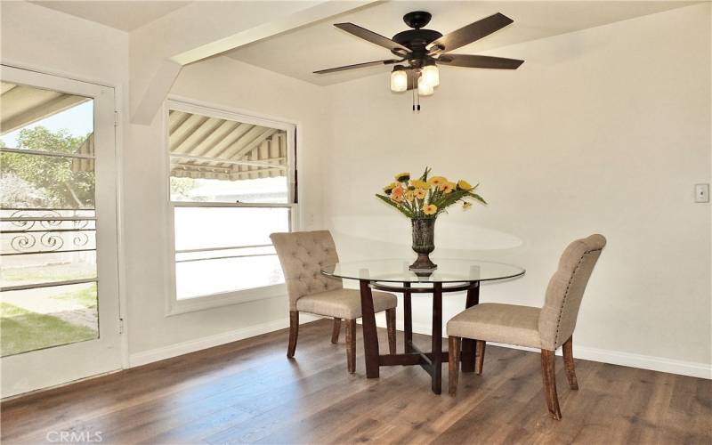 Dinning room with large window with view of the back yard