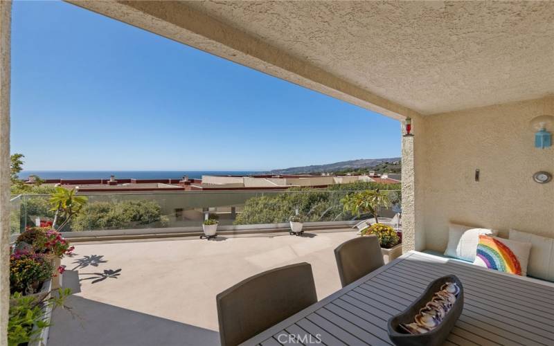 Covered sitting area leads onto patio