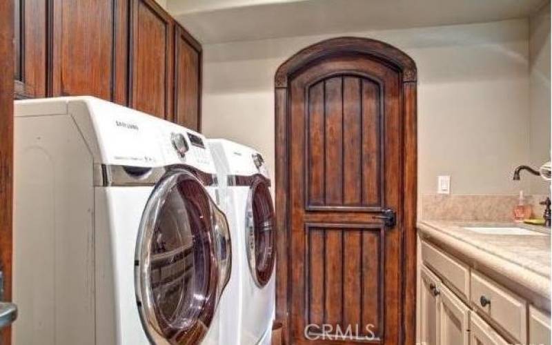 Indoor laundry room of family room and garage.