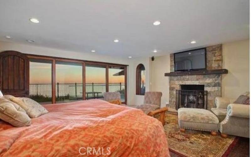 Oceanview main bedroom with fireplace