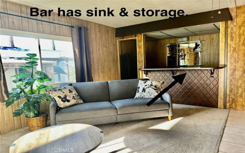 CUPBOARDS & SINK IN FAMILY ROOM.