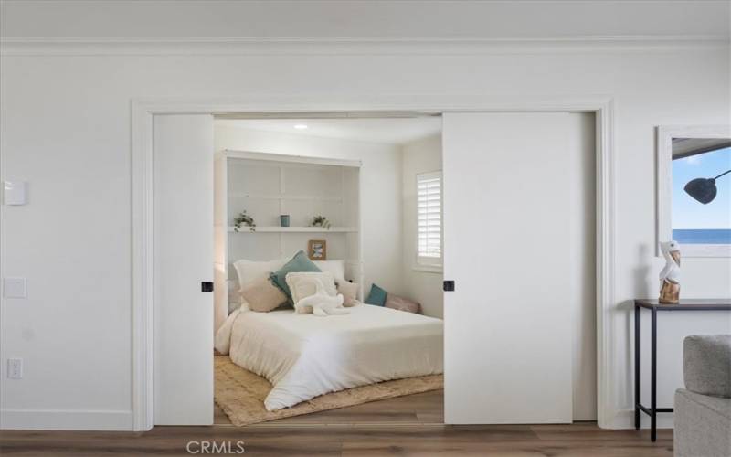 Bedroom two has pocket doors for privacy