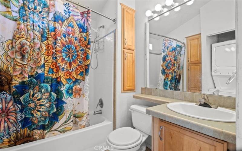 Full Bathroom with stacked washer/dryer